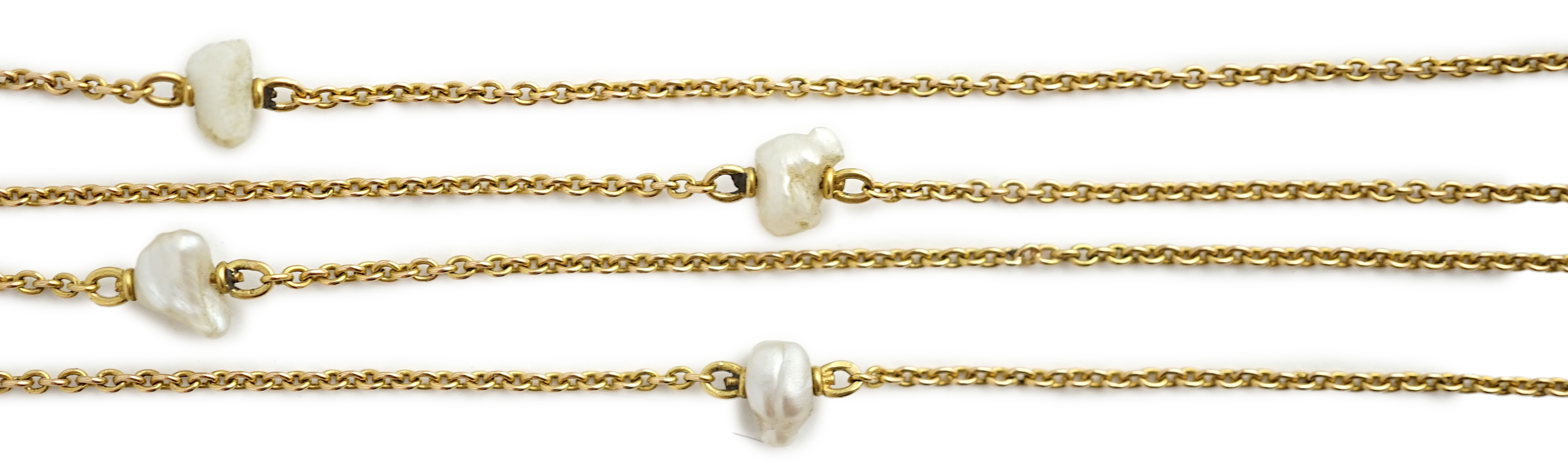 An early 20th century 15ct gold and ten stone baroque pearl set chain necklace